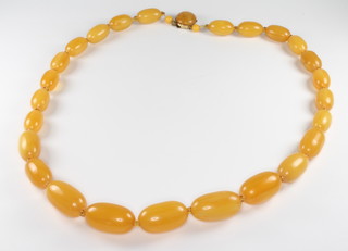 A set of honeycomb coloured amber beads 63cm, gross weight 71 grams, largest bead is 27mm x 15mm 