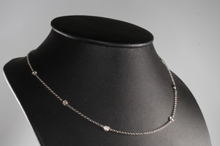 An 18ct white gold 10 stone diamond set necklace 1.2ct, 40cm 