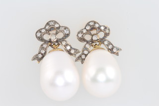 A pair of gilt cultured pearl and diamond bow top earrings 22mm 