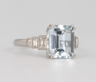 A platinum aquamarine and diamond ring, the centre stone 10mm x 8mm, size P 