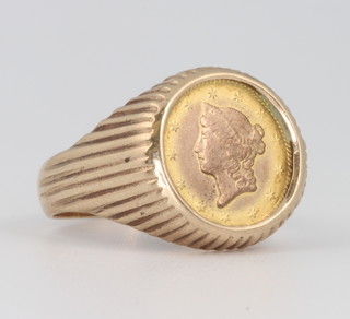 A 9ct yellow gold ring mount set with an 1853 1 dollar coin, gross 6.2 grams 