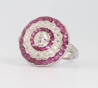 A platinum, ruby and diamond target ring, ruby weight 2.95ct, diamond 1.0ct, 19mm, size M 1/2
