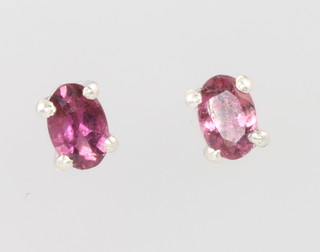 A pair of silver and pink tourmaline oval ear studs