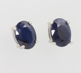 A pair of silver and sapphire ear studs