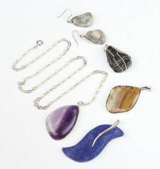 Four silver mounted hardstone pendants together with a pair of hardstone earrings