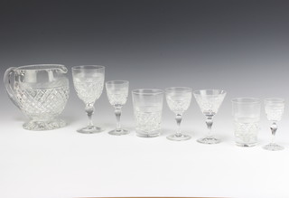 A suite of Webb Crystal table glassware comprising 6 large wine glasses, 6 cocktails, 5 sherry, 5 small sherry, 6 liqueurs, 6 small tumblers, 6 large tumbles, a water jug 