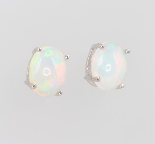 A pair of silver Ethiopian opal ear studs