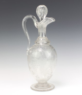 A good Edwardian cut glass bulbous ewer and stopper, extensively decorated with scrolling vines, grapes and birds with monogram and crest, the base with geometric engraving 40cm 