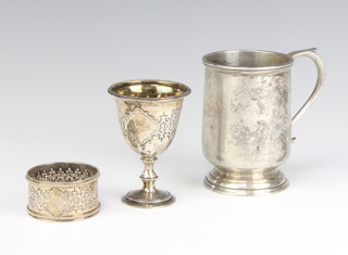 A silver baluster mug, Birmingham 1931 together with an egg cup and a napkin ring, 240 grams