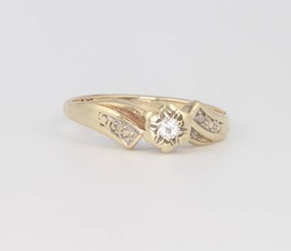 A 9ct yellow gold single stone diamond cross-over ring, size N 1/2 2.3 grams 