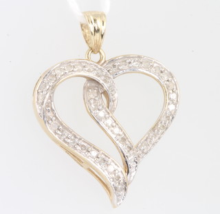 A 9ct yellow gold diamond set double heart pendant, 25mm