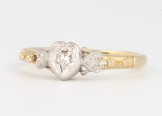 An 18ct yellow gold heart shaped diamond set ring, size M, 2.6 grams