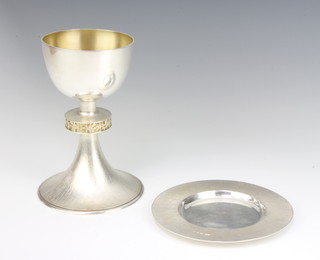 A silver and silver gilt chalice of plain form with splayed foot 17cm together with a matching patent 14.5cm, London 1993, 508 grams, maker C N L 