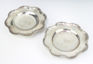 A pair of Edwardian silver dishes raised on scroll feet Edinburgh 1909, maker Hamilton and Inches, 21cm, 688 grams