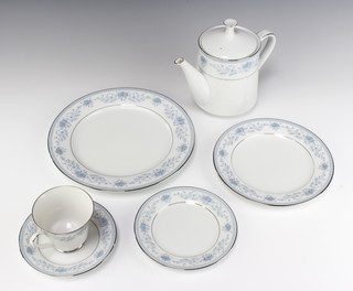A Noritake Blue Hill pattern tea and dinner service comprising 12 tea cups, 12 saucers, 6 cereal/dessert bowls, 6 larger bowls, 1 oval serving plate, a milk jug, sugar bowl and lid, pair of condiments, 17 small plates, 6 medium plates, 6 large plates, sauce boat, a coffee pot, 3 lidded tureens 