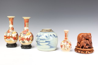 A Chinese provincial ginger jar decorated with an extensive landscape 14cm, a pair of late Satsuma bottle vases 21cm, a smaller ditto 15cm and a composition group of elephants on a similar stand 12cm 