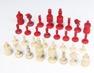 A 19th Century carved and stained turned ivory chess set, the king 9cm 