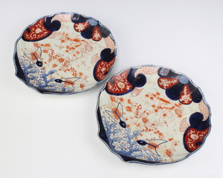 A pair of late 19th Century Chinese Imari shell shaped dishes decorated with fish amongst flowers 33cm 