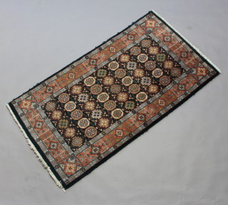 A blue and tan ground Bidjar rug with central medallion within a 3 row border 148cm x 81cm 