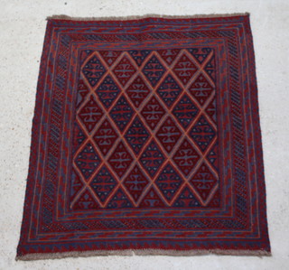 A blue and red ground Gazak rug, the central field with diamond pattern 122cm x 108cm 