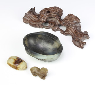 A model soapstone oval archaistic style bowl 11cm, ditto carving of a beetle 6cm, a shi shi 5cm and a carved wood stand decorated with flowers 20cm 