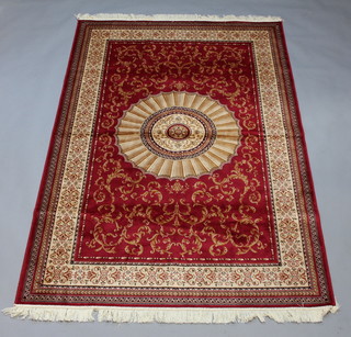 A red and gold ground Belgian cotton Kashan style rug with central medallion 234cm x 151cm