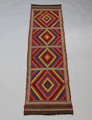 A multi coloured  Kilim runner with 4 stylised diamonds to the centre 227cm x 61cm 
