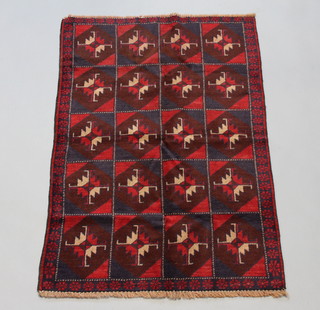 A red and blue ground Afghan rug formed of 20 rectangular panels 133cm x 86cm 
