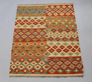 A yellow, tank and green ground Kilim rug formed of 10 rectangular panels 150cm x 103cm 