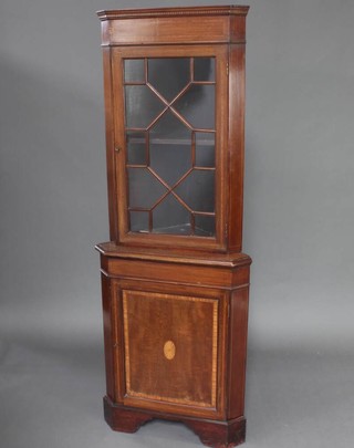 A 19th Century inlaid mahogany double corner cabinet, fitted shelves enclosed by astragal glazed panelled doors, the base enclosed by a panelled door, raised on bracket feet 182cm h x 67cm w x 47cm d 