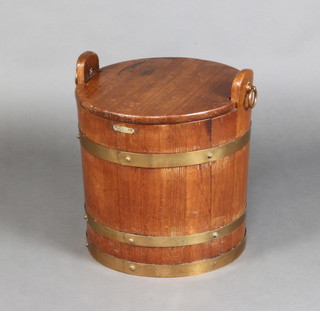 Of maritime interest, a circular barrel shaped teak coal box with drop handles, formed from the teak of HMS Warspite 45cm h x 42cm diam. 