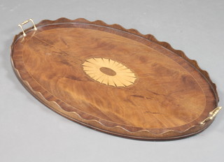 An Edwardian style oval inlaid mahogany twin handled tea tray with wavy border 83cm x 56cm 
