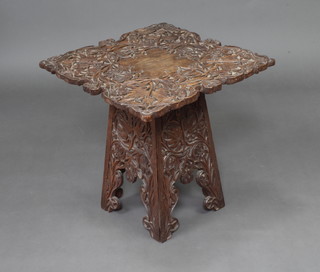 A 19th Century square Eastern deeply carved hardwood occasional table raised on a folding stand 54cm x 51cm x 52cm 
 