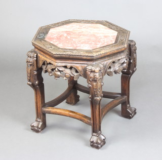 An octagonal Chinese carved hardwood jardiniere stand with pink veined marble top raised with carved and pierced apron 46cm h x 43cm x 43cm 
