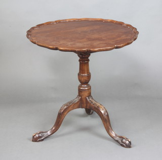 An Edwardian circular mahogany Chippendale style tea table with pie crust edge and bird cage action, raised on a bulbous turned column and tripod supports, egg and dart feet 72cm h x 71cm diam. 