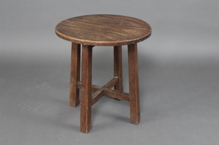 A circular oak Arts and Crafts occasional table raised on 3 outswept supports with X framed stretcher, the leg with scarab beetle mark 54cm x 51cm 