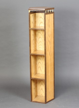 An oak and "Zetan" key stone shaped  bookcase fitted 4 shelves 130cm h x 35cm w x 33cm d 