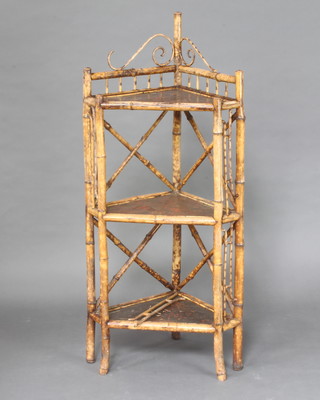 A 1920's bamboo and lacquered 3 tier corner what not 129cm h x 57cm w x 38cm d (f)