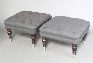 A pair of Victorian style square stools upholstered in black buttoned felt material, raised on turned supports with chrome caps and casters 46cm h x 66cm w x 66cm 