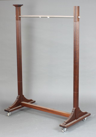 A mahogany and chrome clothes rail 153cm h x 117cm w x 67cm d 