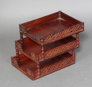 A Chippendale style 3 tier mahogany in tray with blind fretwork decoration 28cm x 27cm w x 47cm 