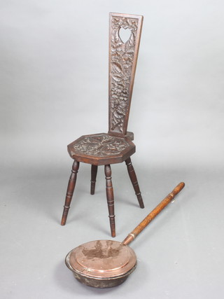 A 19th Century carved oak spinning chair and a 19th Century copper warming pan with turned oak handle 