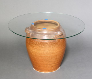 A circular 3 handled pottery crock with circular plate glass top to form a coffee table 39cm h x 61cm diam.  