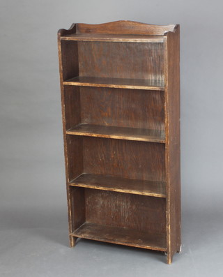 A 1930's oak 4 tier bookcase with raised back 128cm h x 61cm w x 19cm d (some ring marks in places) 