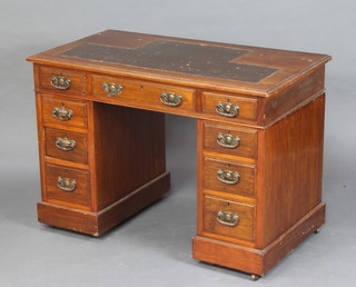 A Victorian mahogany desk with inset writing surface, fitted 1 long and 8 short drawers 75cm h x 107cm w x 60cm d (1 handle is damaged)