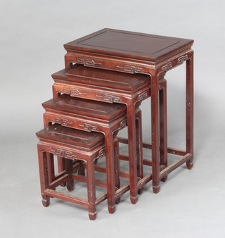 A nest of 4 Chinese rectangular carved padauk interfitting coffee tables 66cm h x 50cm w x 35cm d 