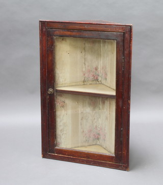A 19th Century mahogany hanging corner cabinet fitted shelves enclosed by a glazed panelled door 95cm h x 63cm w x 34cm d 