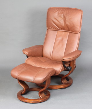 An Ekornes Stressless armchair upholstered in brown hide together with matching stool (1 arm f)