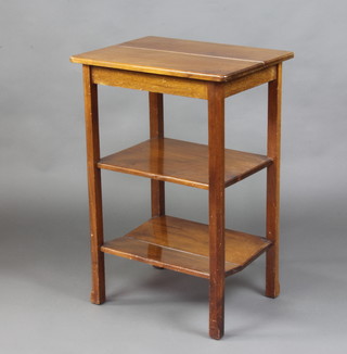 A rectangular walnut 3 tier occasional table raised on square supports 72cm h x 49cm w x 38cm d