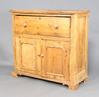 A 19th Century Continental elm secretaire with fall front above a cupboard enclosed by arched panelled doors, raised on bracket feet 110cm h x 119cm w x 50cm d (signs of old but treated worm and splits to the top) 